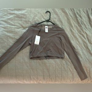 GYMSHARK- lightweight seamless long sleeve crop top. Color-slate lavender. Small